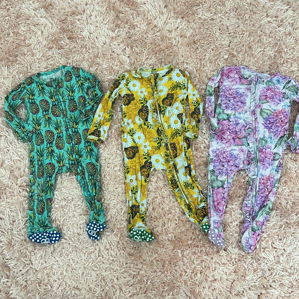 12-18 month Bums and Roses zip up footie pajamas. Excellent used condition.